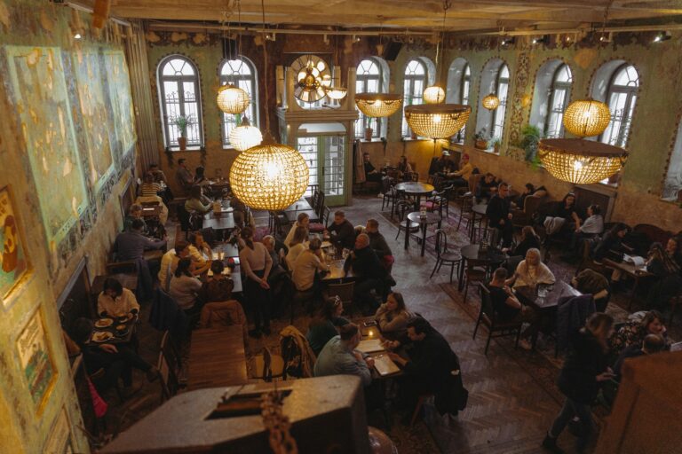 Crowded restaurant full of diners at tables