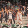 Basketball players on the court during Game 1 of the 2024 WNBA Finals between the New York Liberty and Minnesota Lynx at Barclays Center.